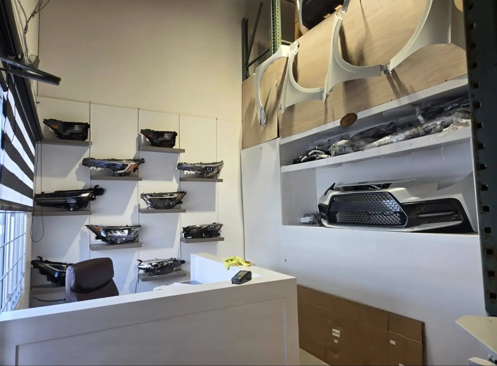 KDR reception counter with headlights, fenders and a bumper on display